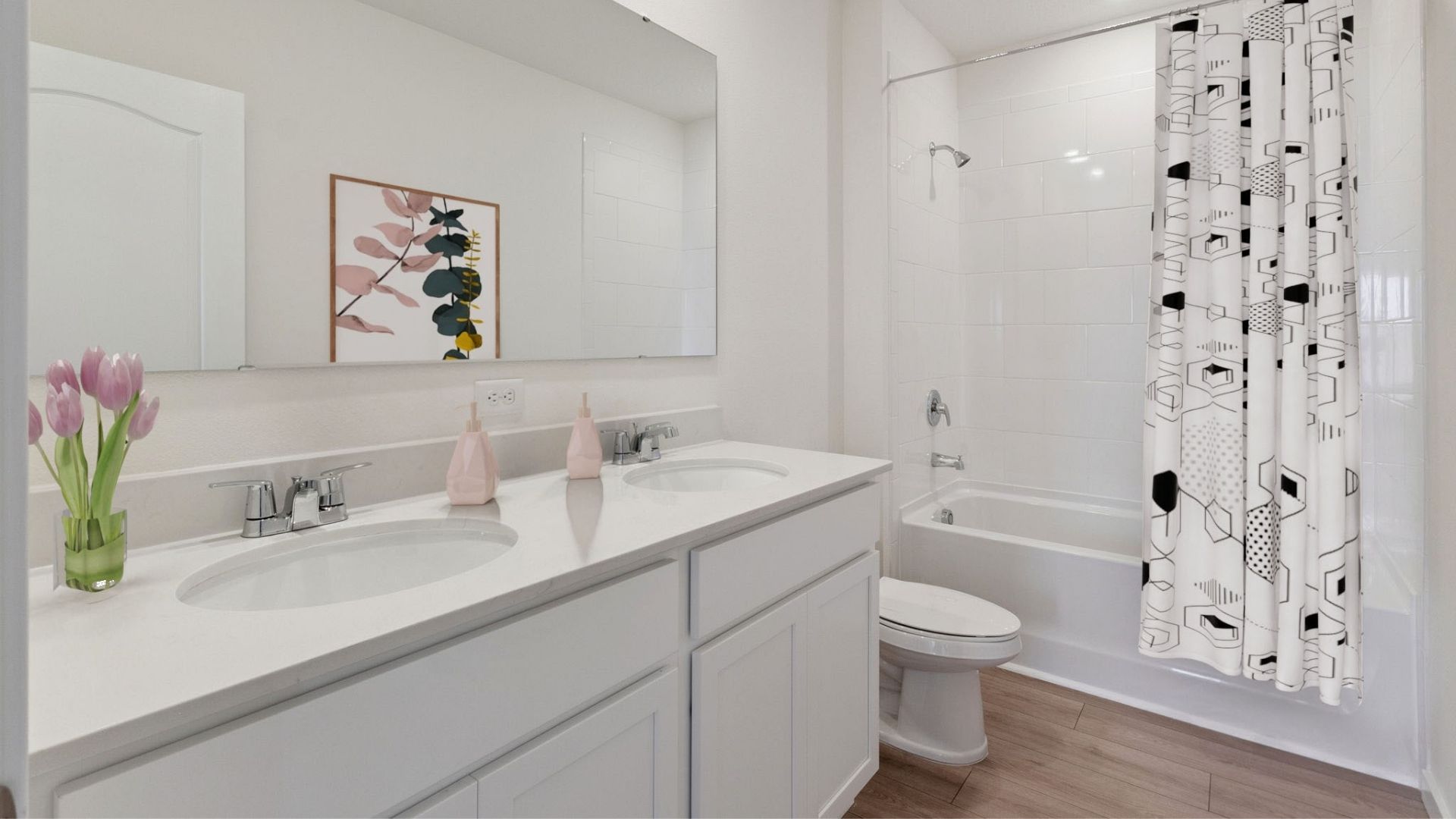 Modern bathroom with double vanity, large wall mirror, cabinets and quartz countertops