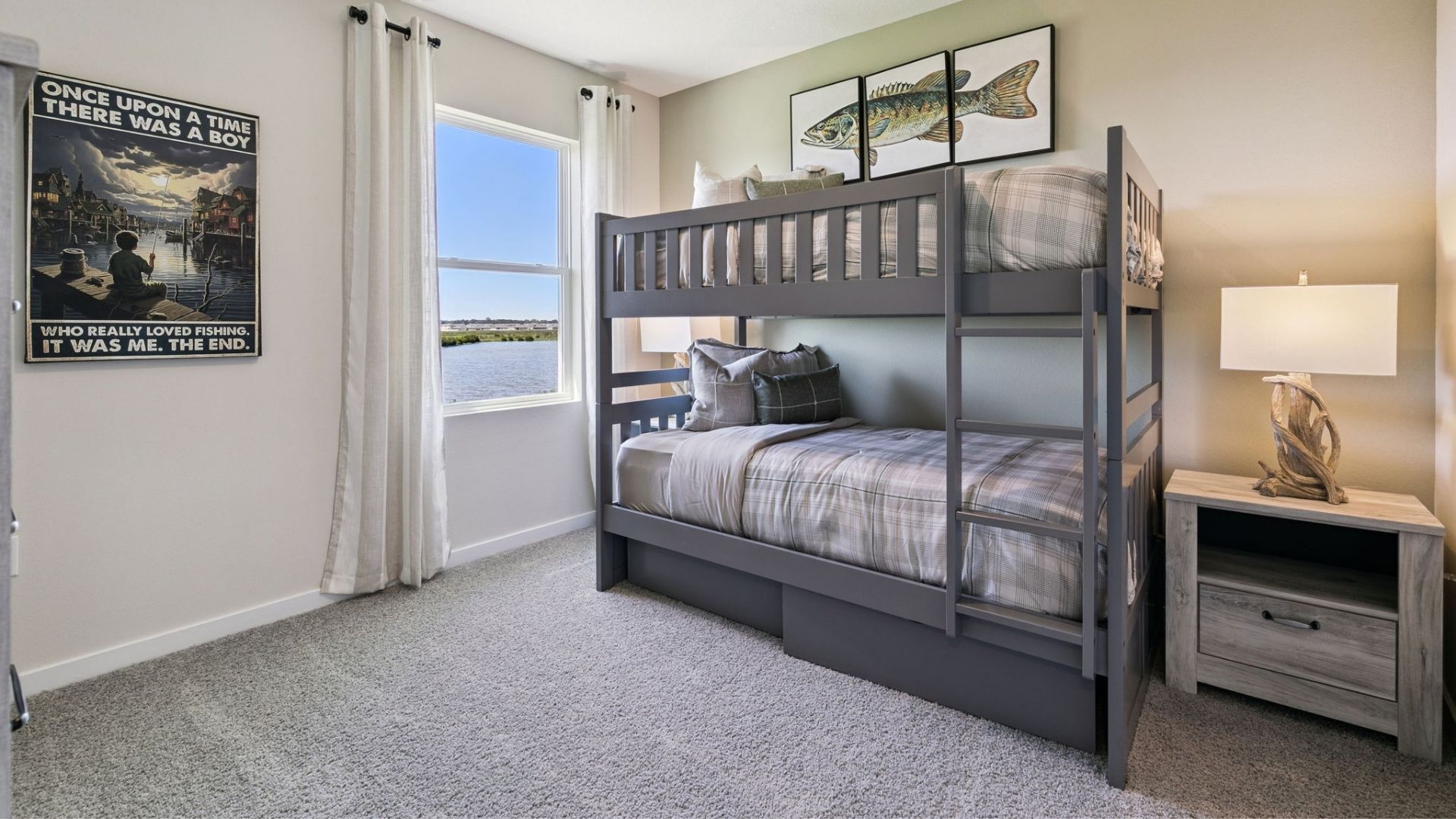 Spacious primary bedroom with king size bed, carpet flooring, natural lighting.