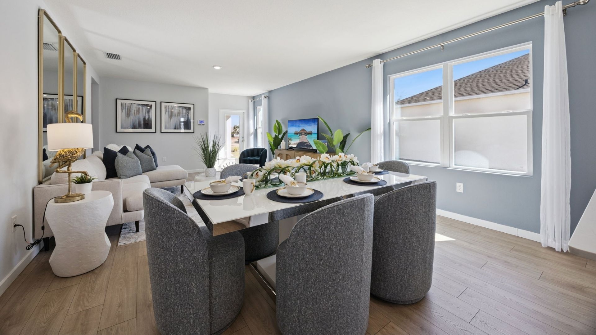 Dining room area with table, seating and natural lighting.