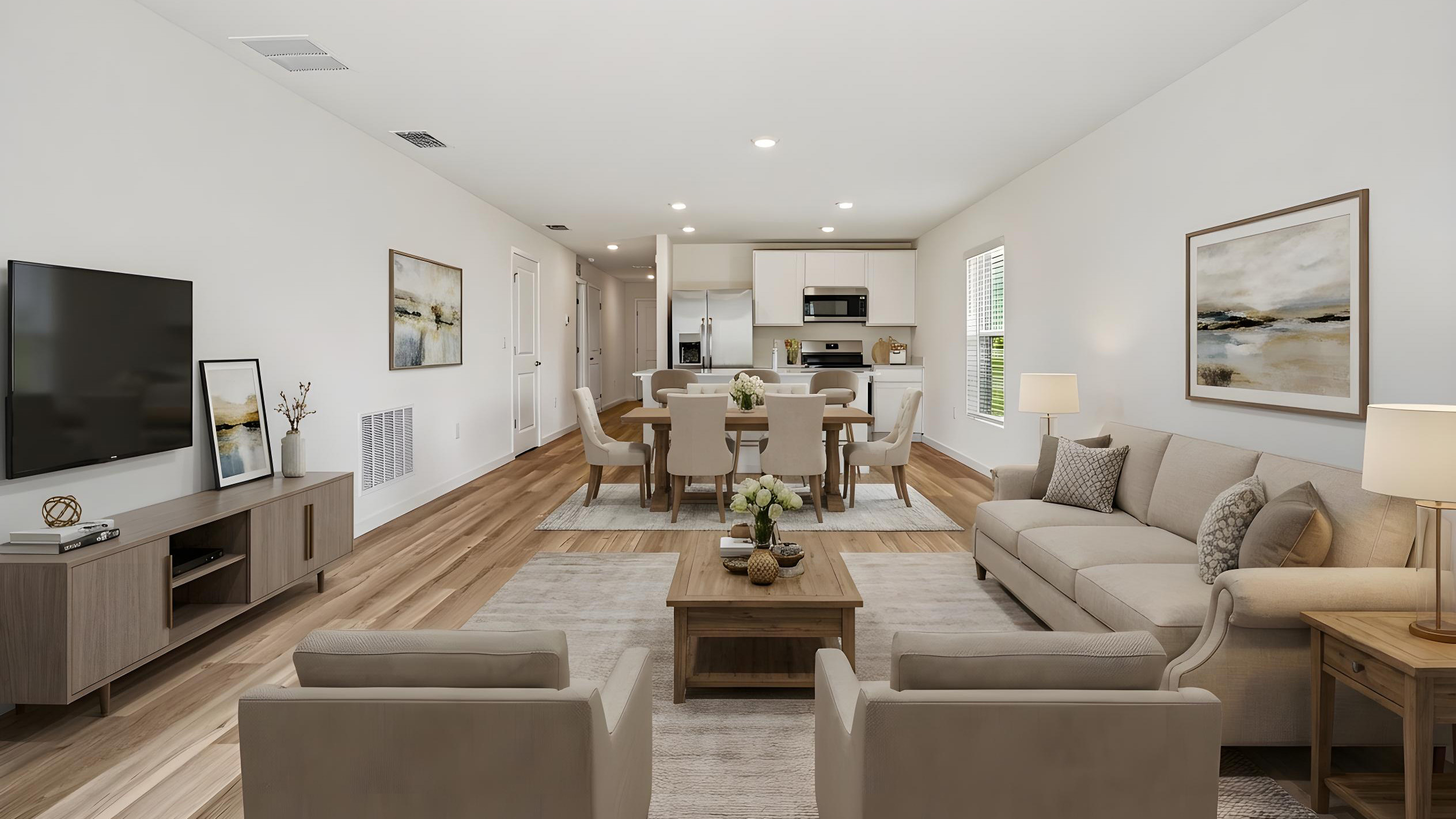 Living area showing open concept overseeing dining room table and kitchen