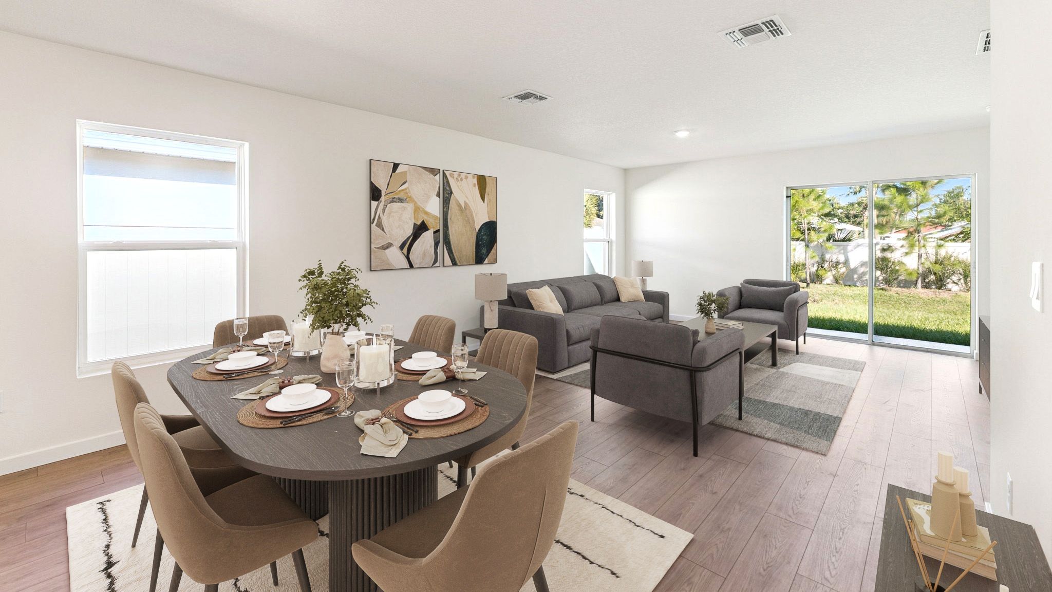 Living area with couch seating, entertainment system and natural lighting