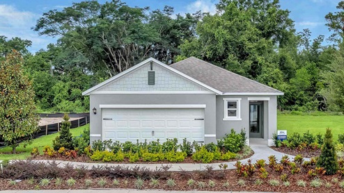 Single story new home covered porch and 2 car garage.