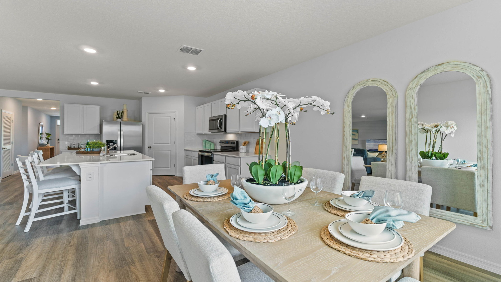 Dining room area with table, seating and natural lighting.