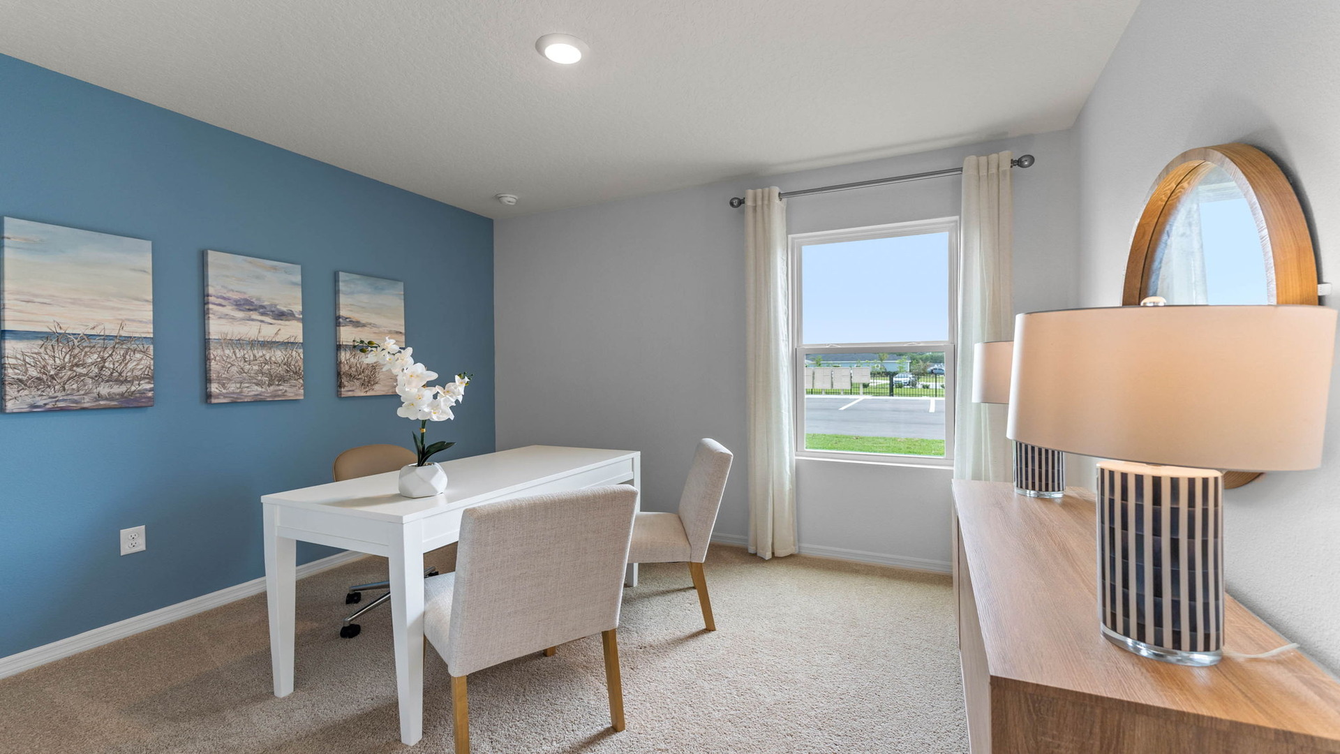 Functional home office with desk, chairs and space to work or play.