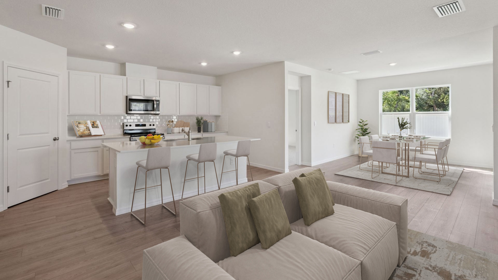 Kitchen with tall cabinetry, appliances, walk in pantry and Luxury vinyl plank flooring.