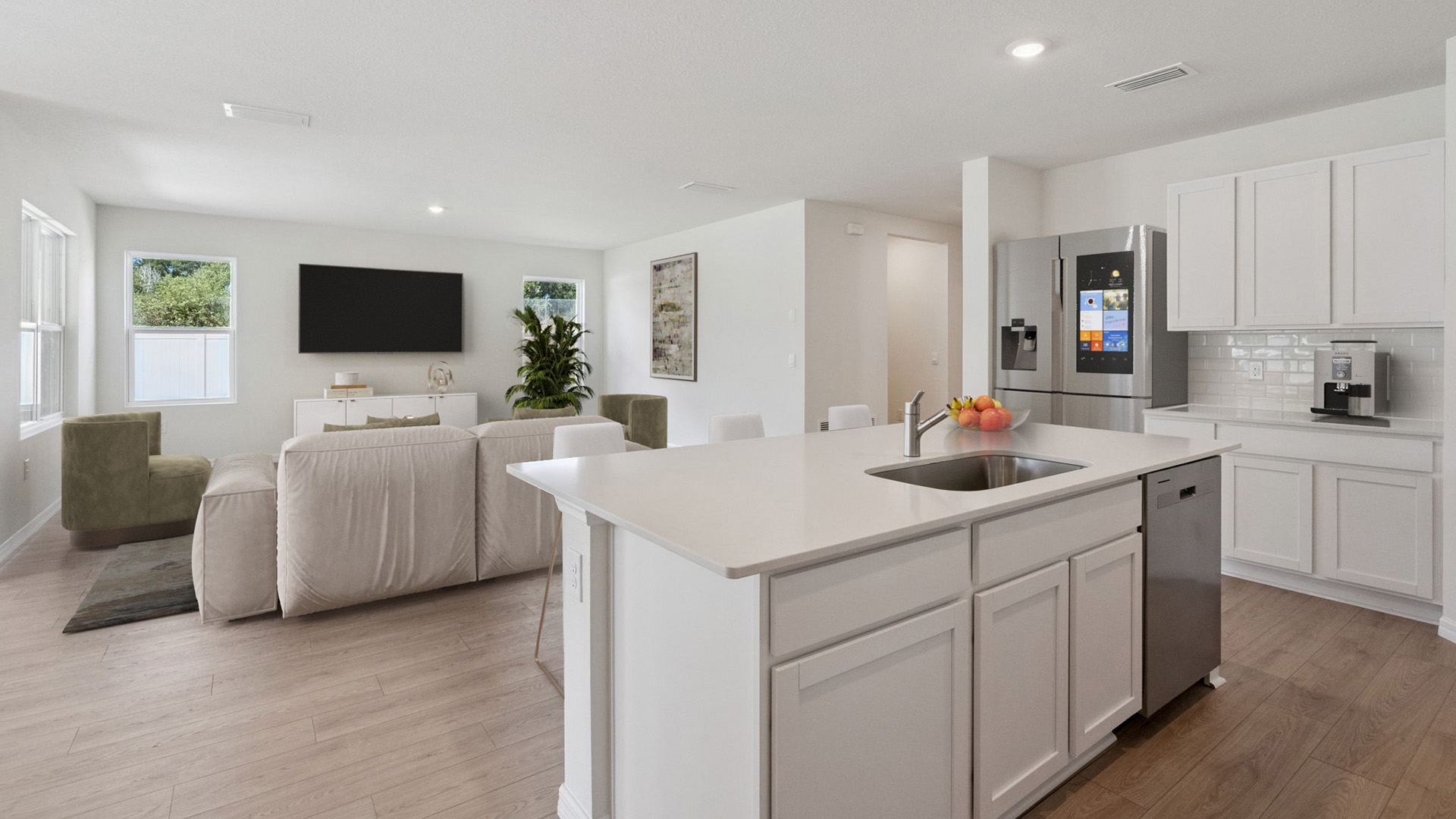 Kitchen with island seating, granite counters, spacous pantry and stainless steel appliances.