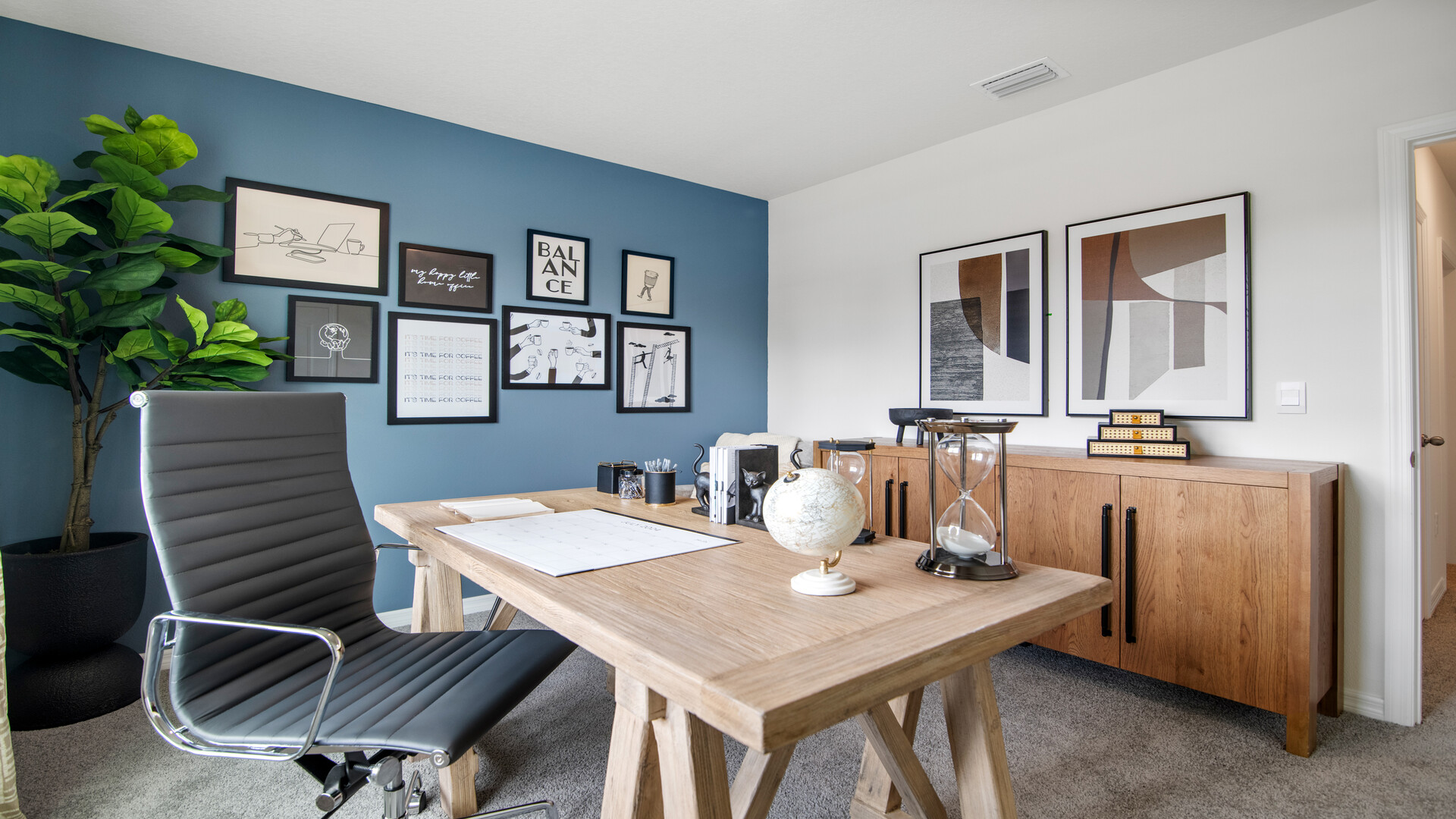 Functional home office with desk, chairs and space to work or play.