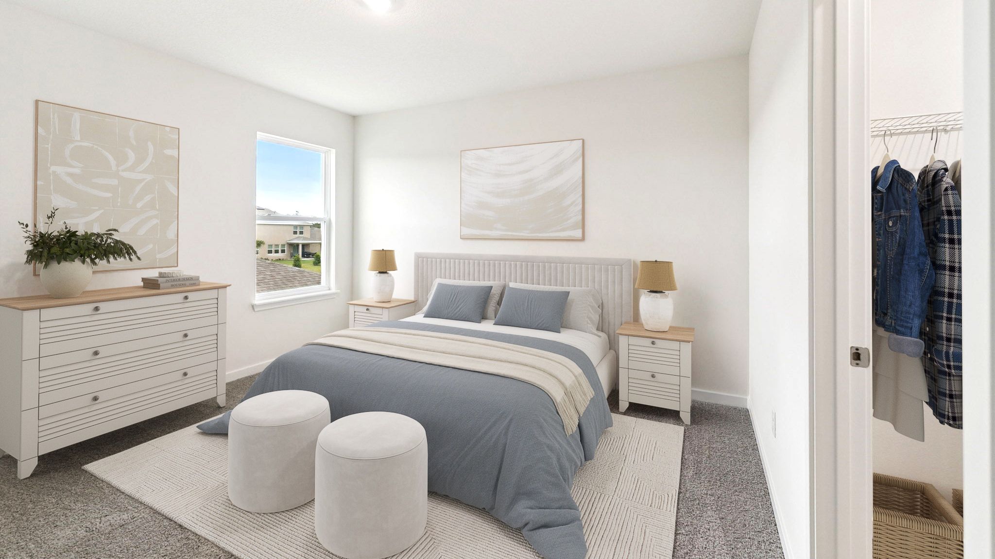 Guest bedroom with bed, nighstand, desk, and natural lighting with spacious closet.