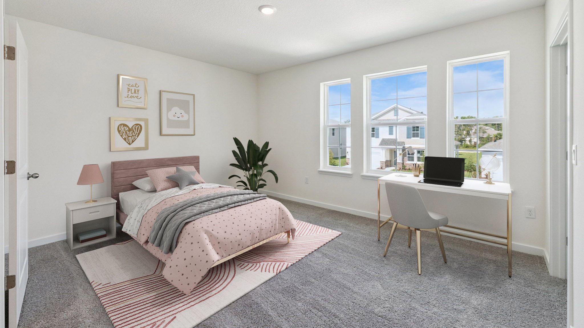 Guest bedroom with bed, nighstand, desk, and natural lighting with spacious closet.