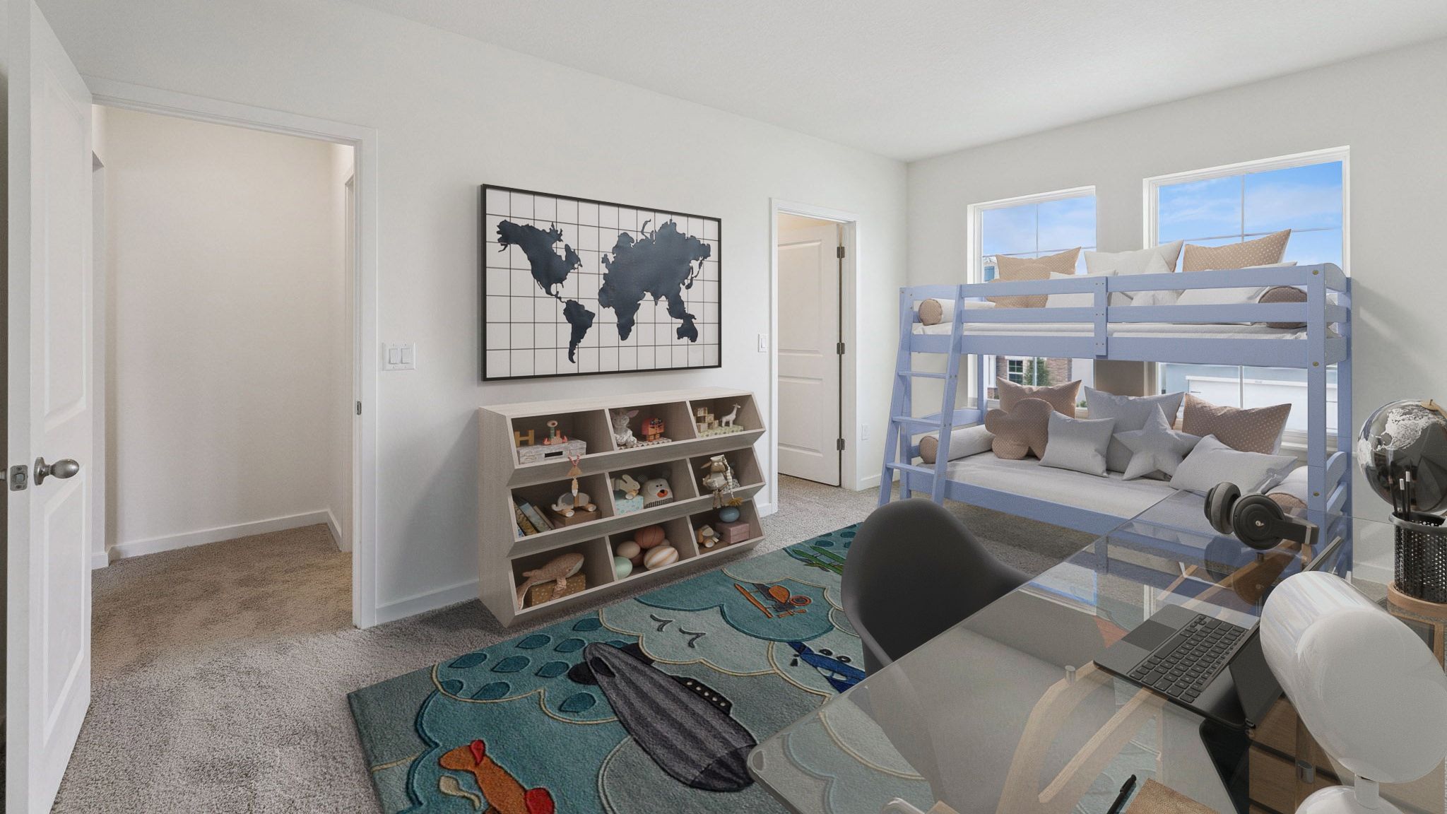 Guest bedroom with bunk bed, toys, nighstand, desk, and natural lighting with spacious closet.
