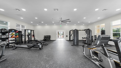 Fitness center with cardio and strength machines.