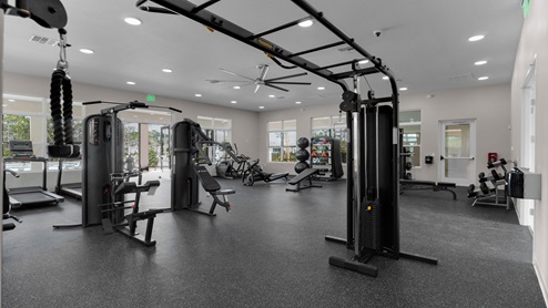 Fitness center with cardio and strength machines.