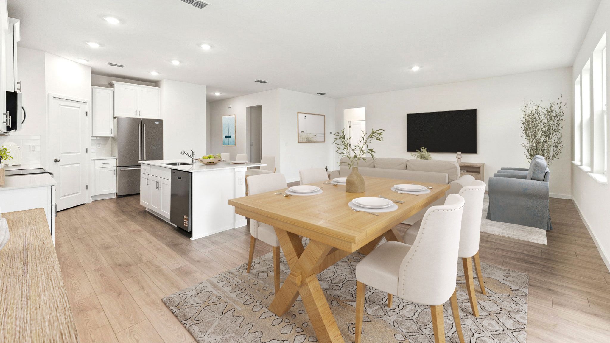 Dining room area with table, seating and natural lighting.