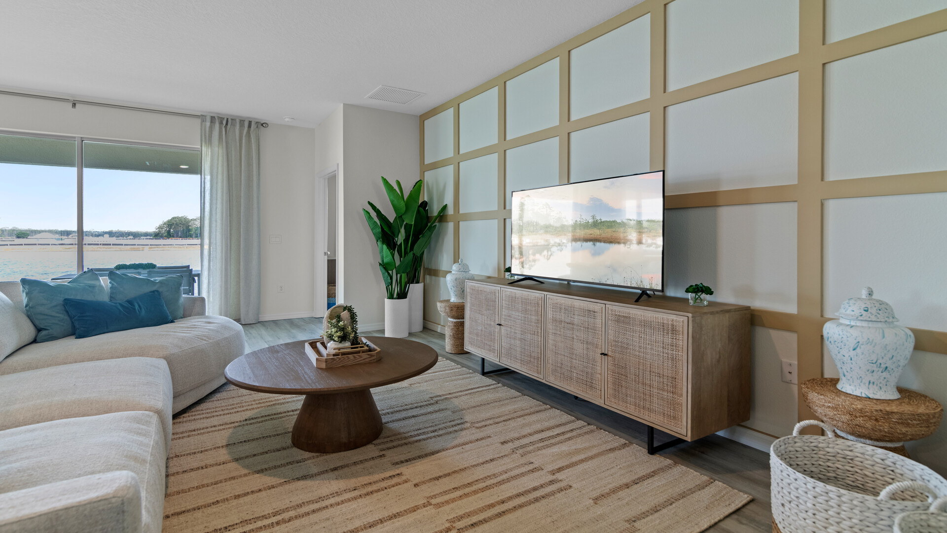 living area with couch seating and entertainment system.
