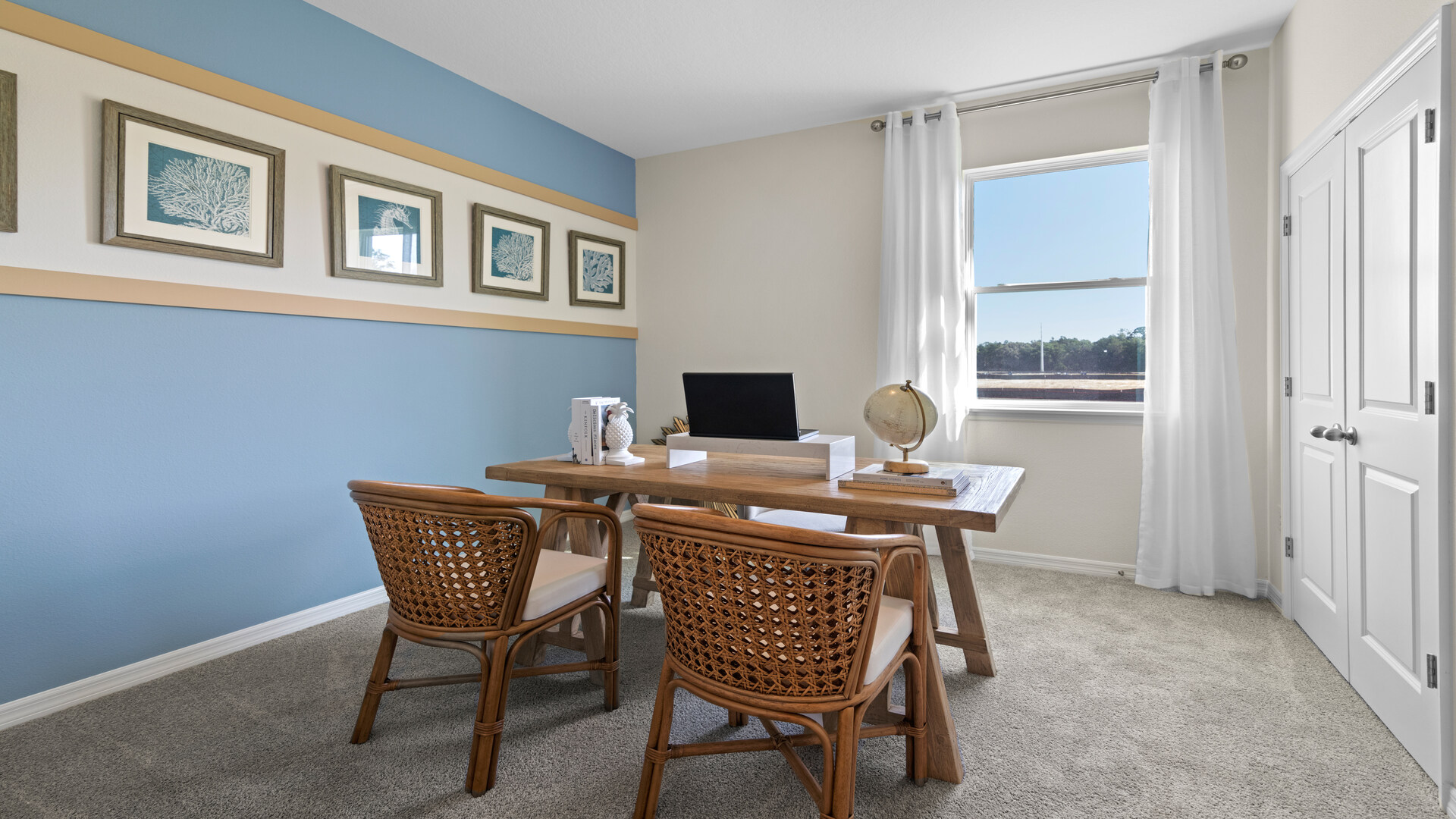 Functional home office with desk, chairs and space to work or play.