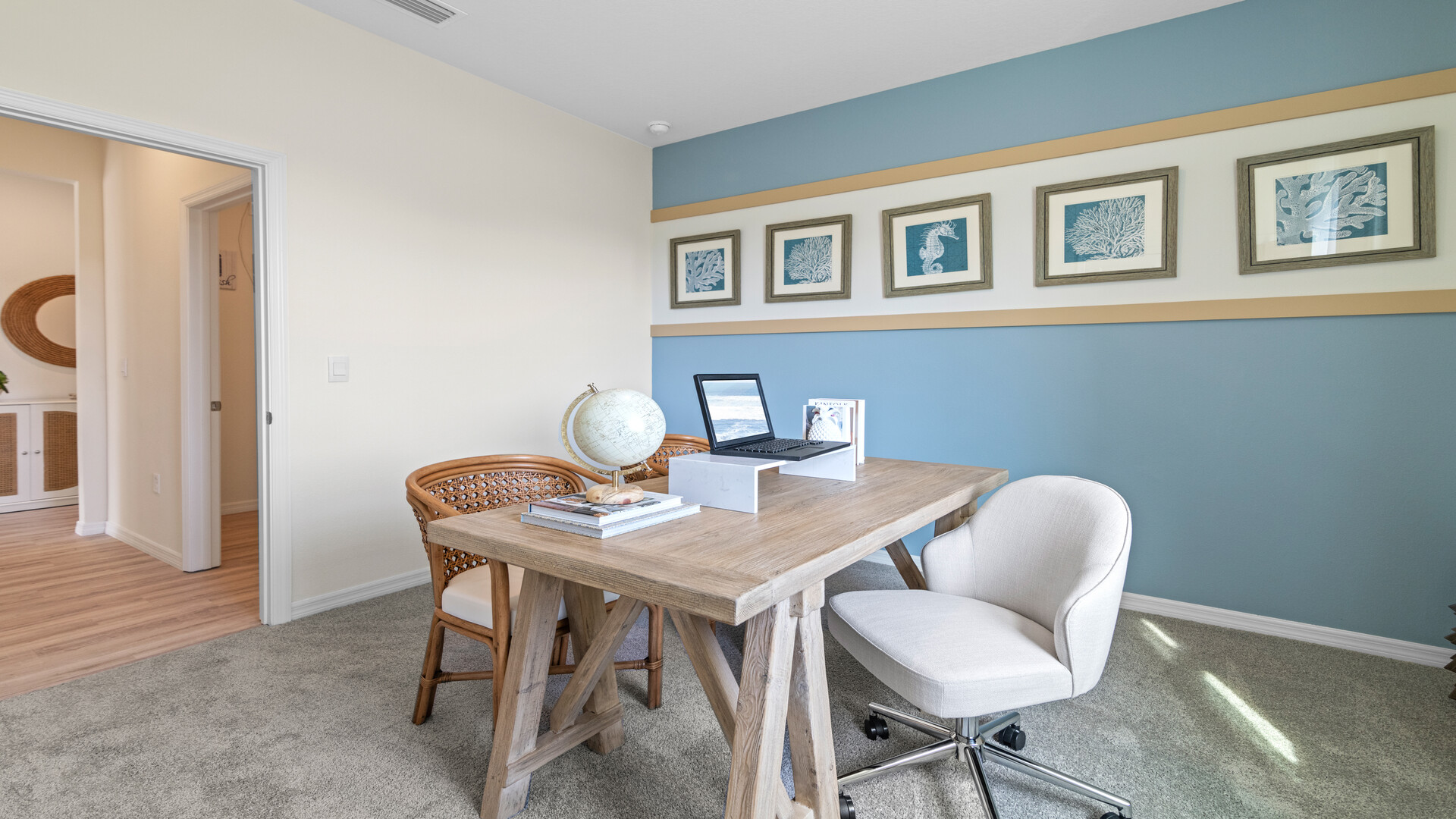 Functional home office with desk, chairs and space to work or play.