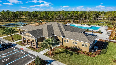 Aerial view of the community amenity area with blue skies and sidewalks
