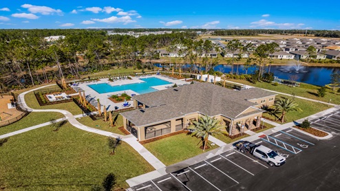 Aerial view of the community amenity area with blue skies and sidewalks