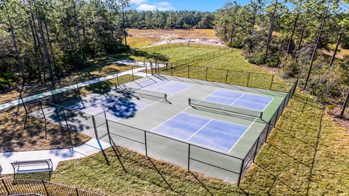 Aerial view of the community amenity area with blue skies and sidewalks