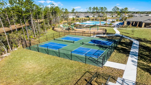 Aerial view of the community amenity area with blue skies and sidewalks