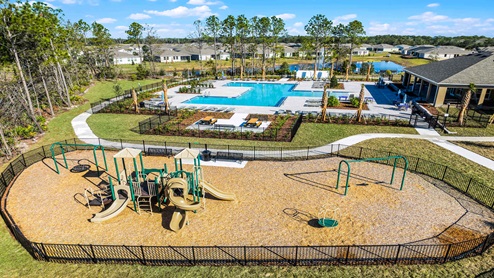 Aerial view of the community amenity area with blue skies and sidewalks