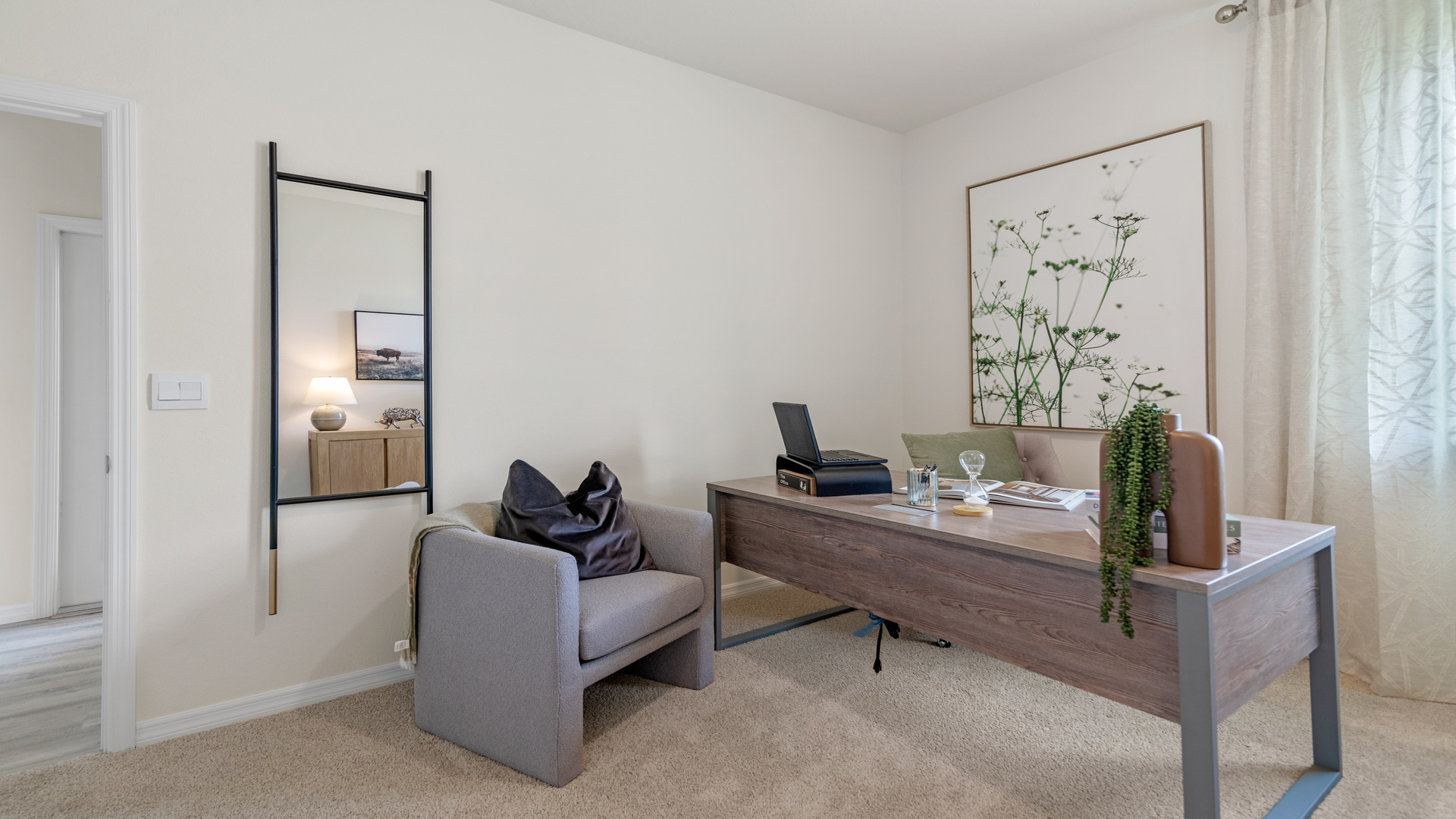 Guest bedroom with bed, nighstands and natural lighting.