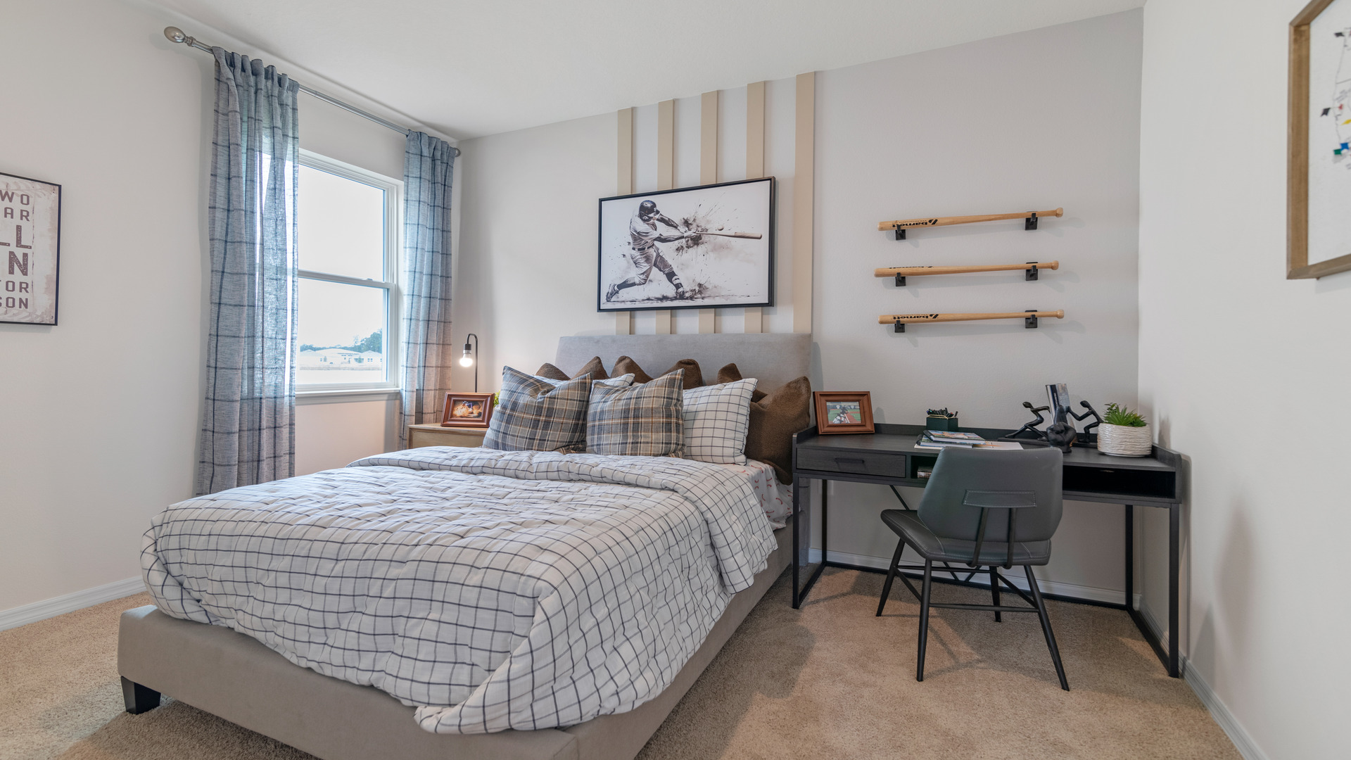 Guest bedroom with bed, nighstands and natural lighting.