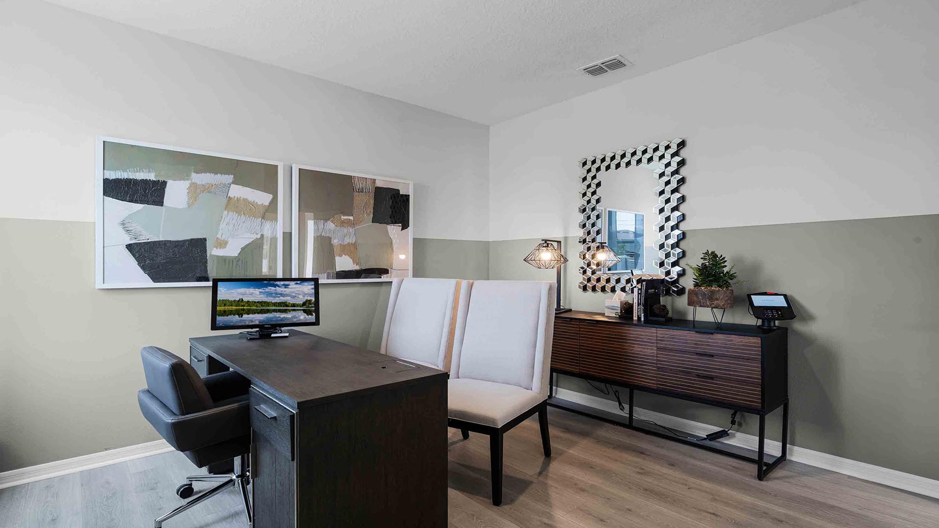 Functional home office with desk, chairs and space to work or play.