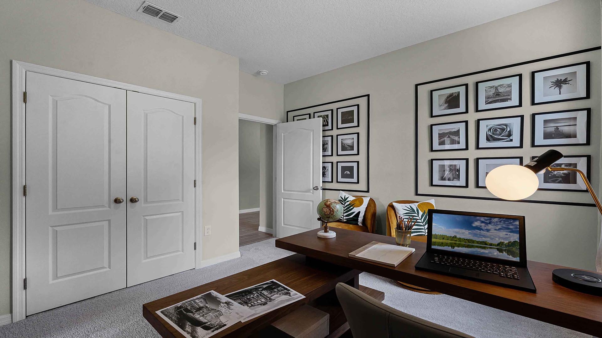 Functional home office with desk, chairs and space to work or play.
