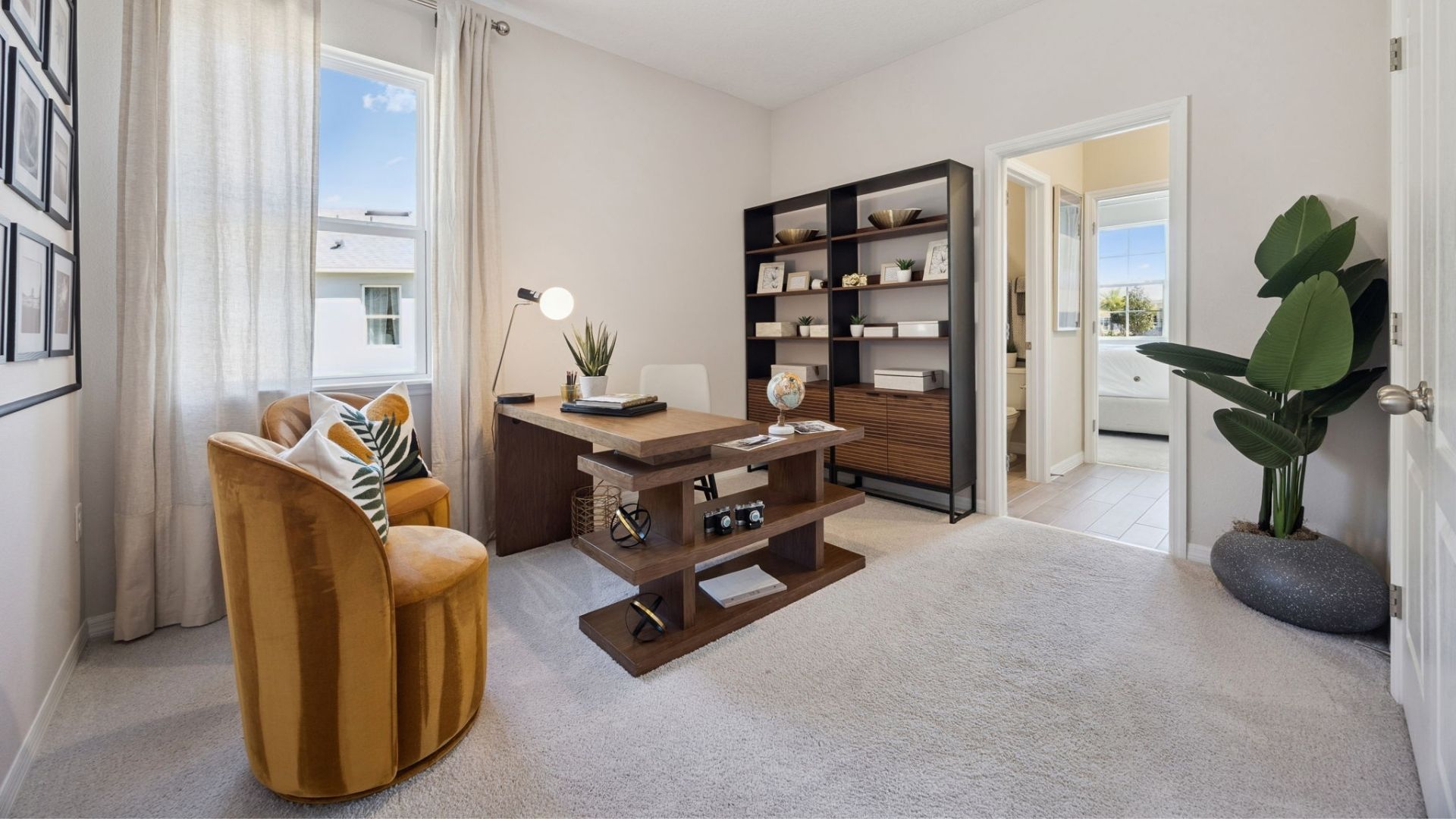 Functional home office with desk, chairs and space to work or play.