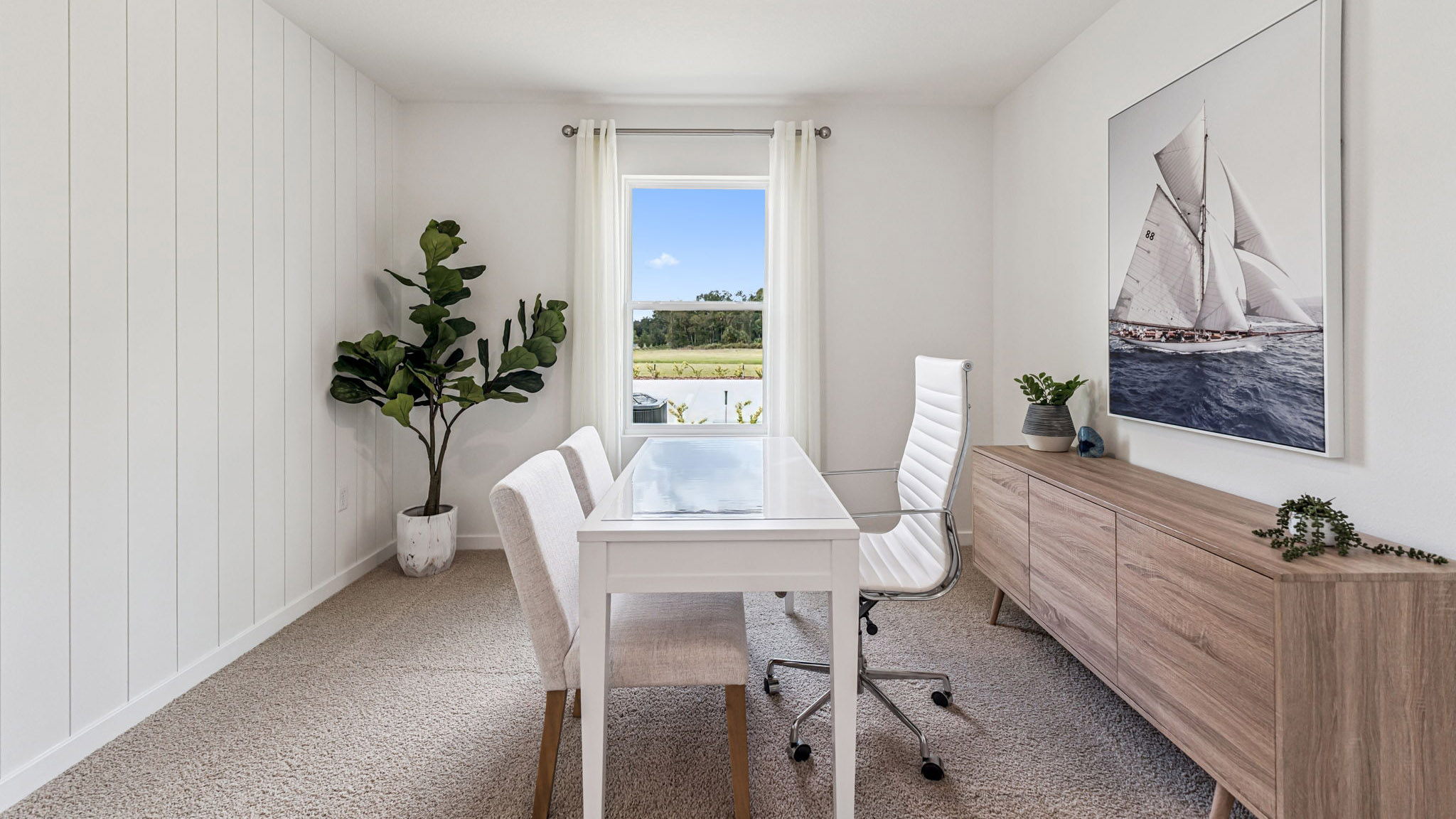 Functional home office with desk, chairs and space to work or play.
