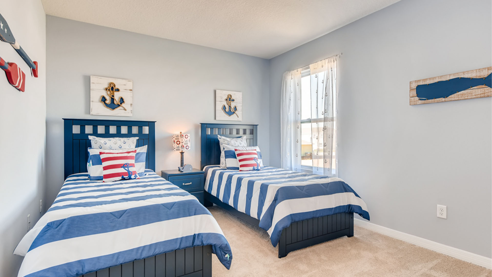 Child's room with toys, bedding, seating and storage and a spacious closet.