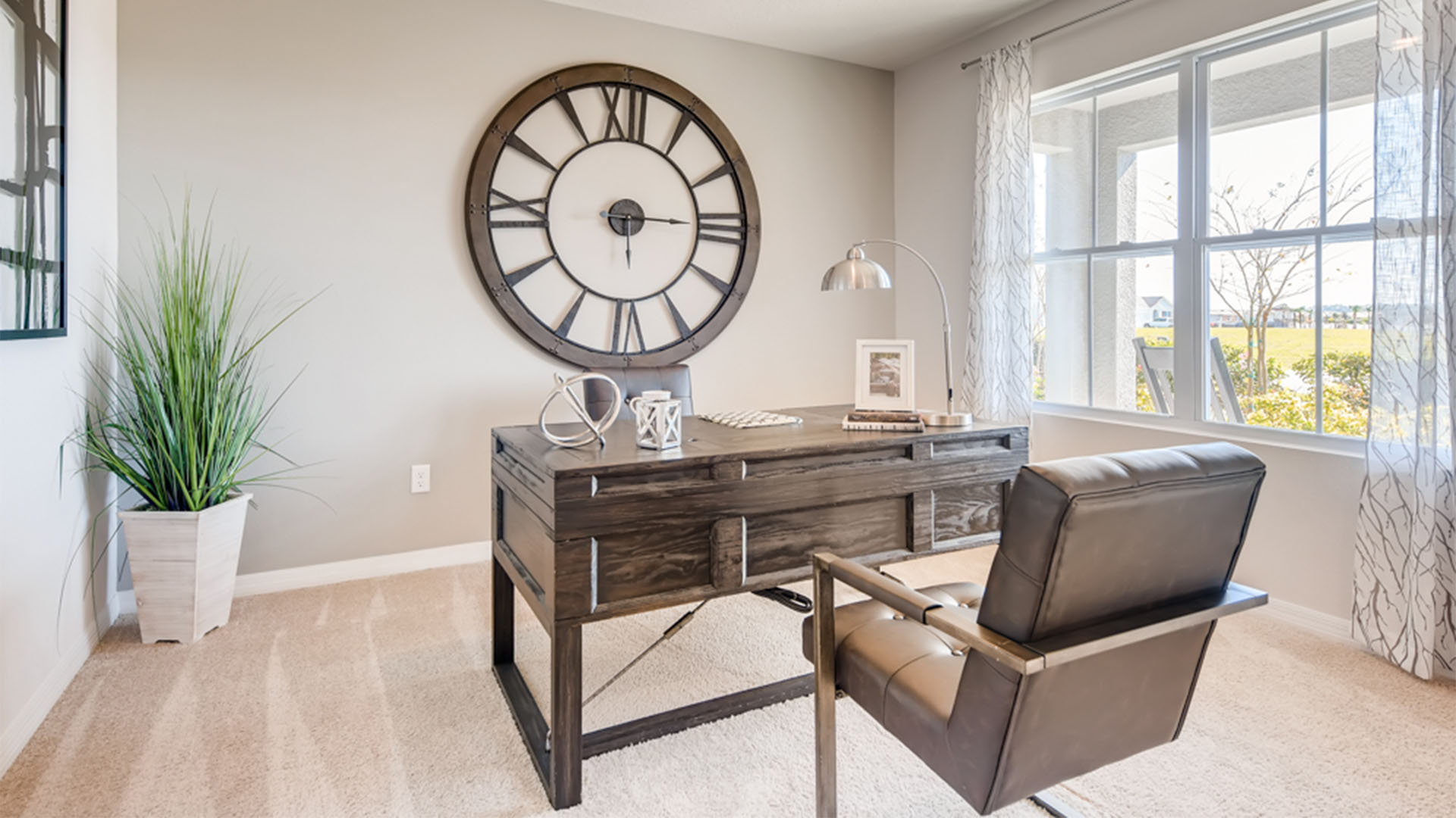 Functional home office with desk, chairs and space to work or play.