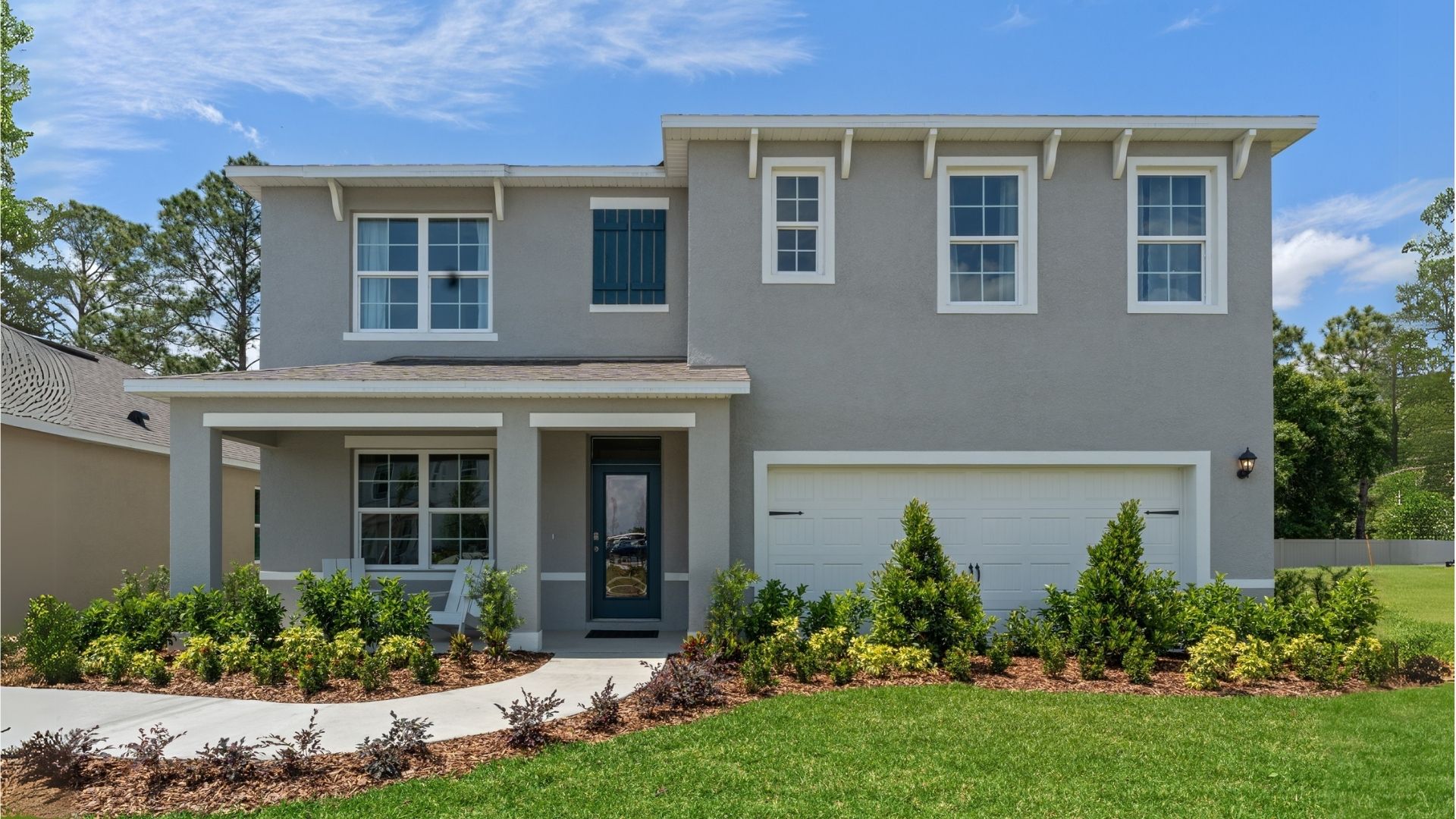 Two-story home with two car garage.