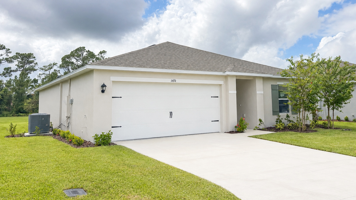 single story white home with 2 car garage
