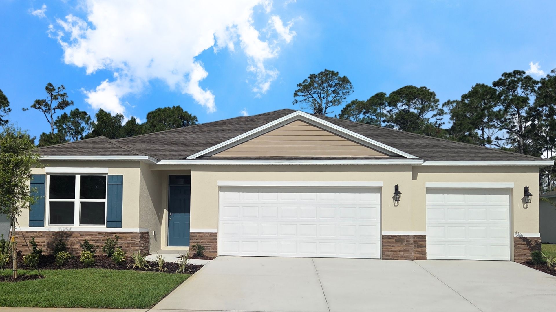 Single story new home with large windows and 2 car garage.
