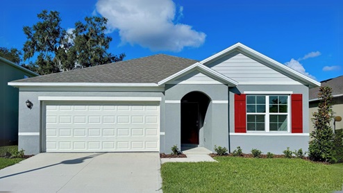 Single story new home with large windows and 2 car garage.