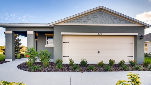 Single story new home with large windows and 2 car garage.