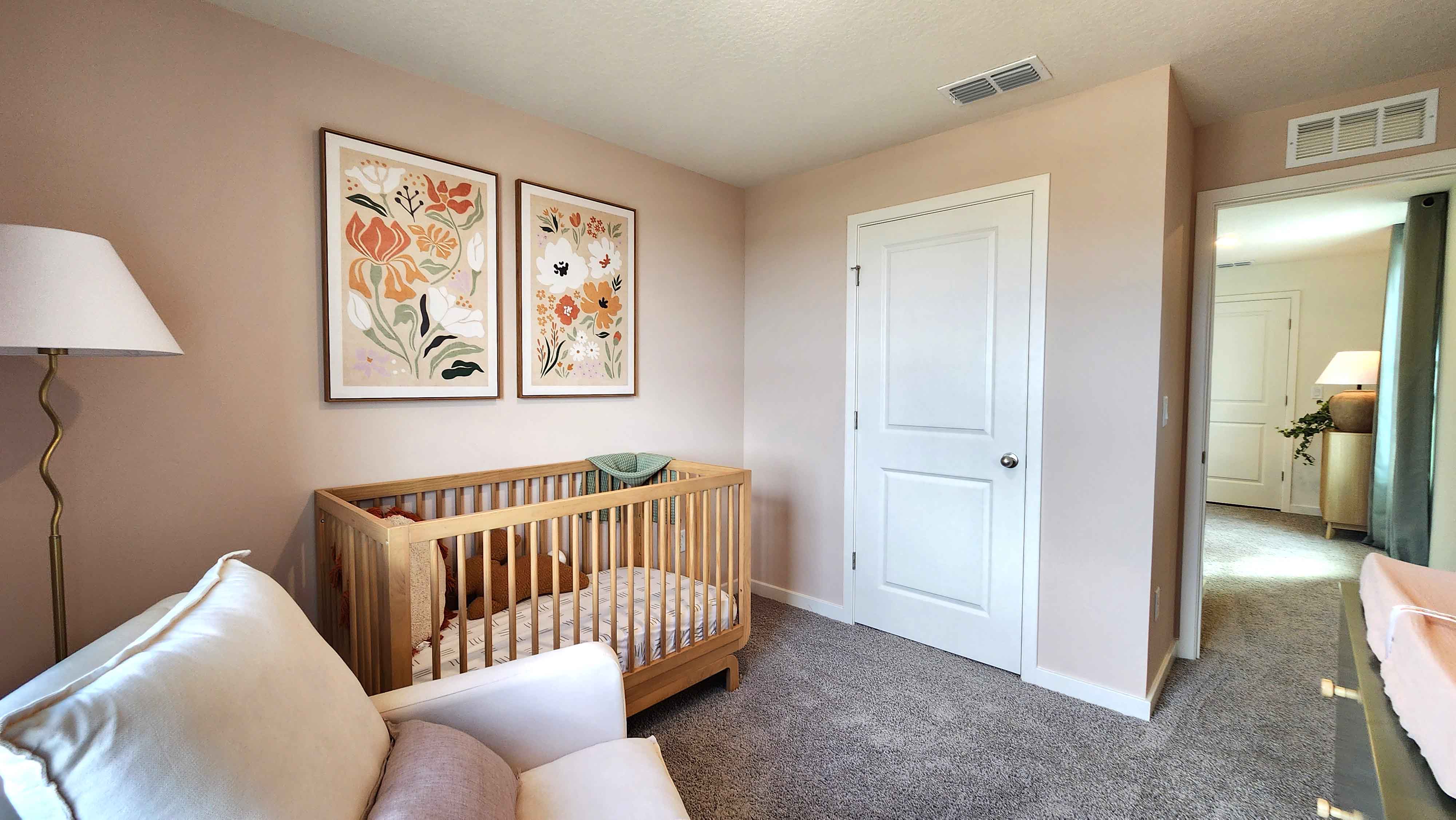Guest bedroom with bed, nighstands and natural lighting and spacious closet.