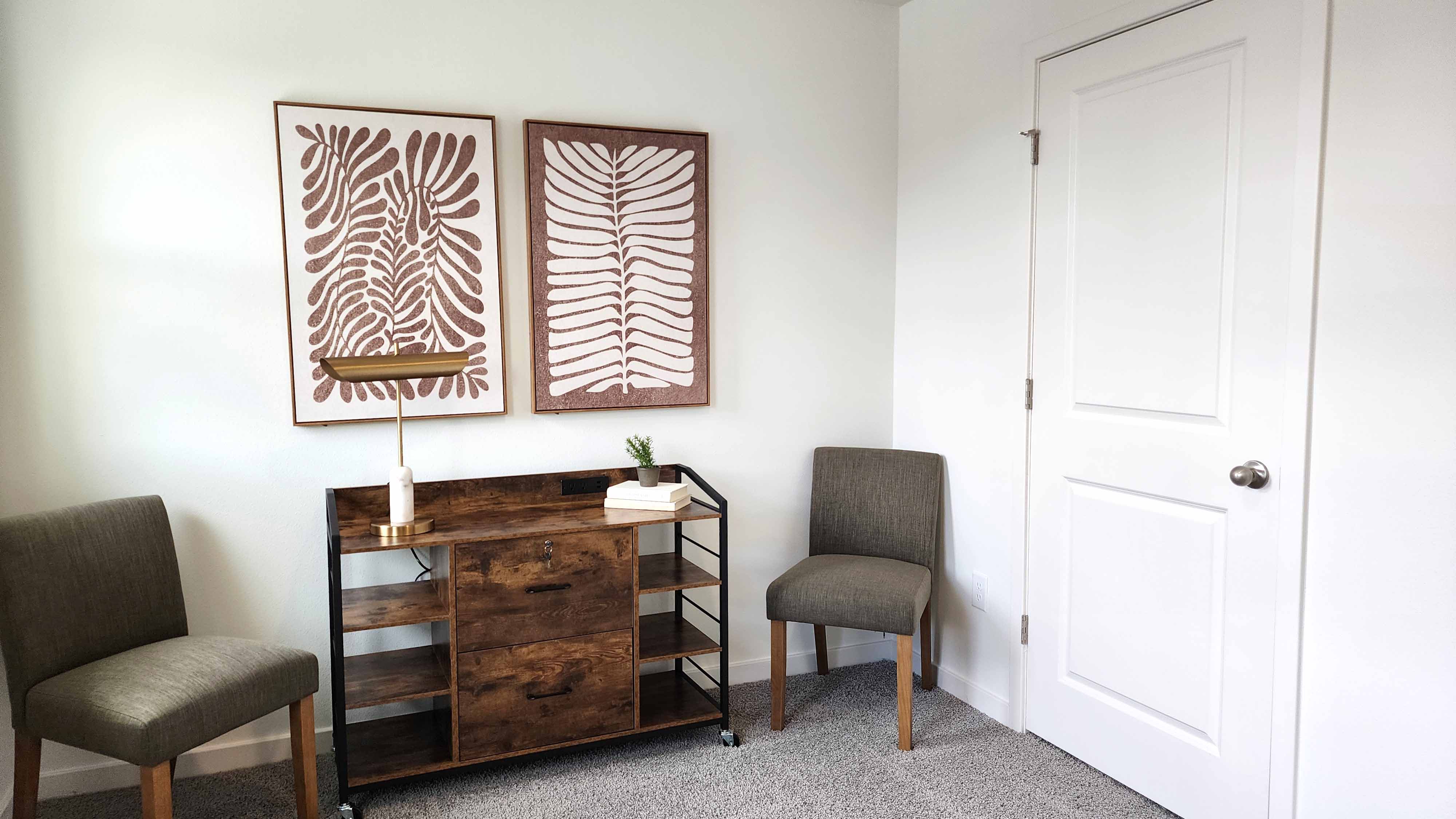 Functional home office with desk, chairs and space to work or play.