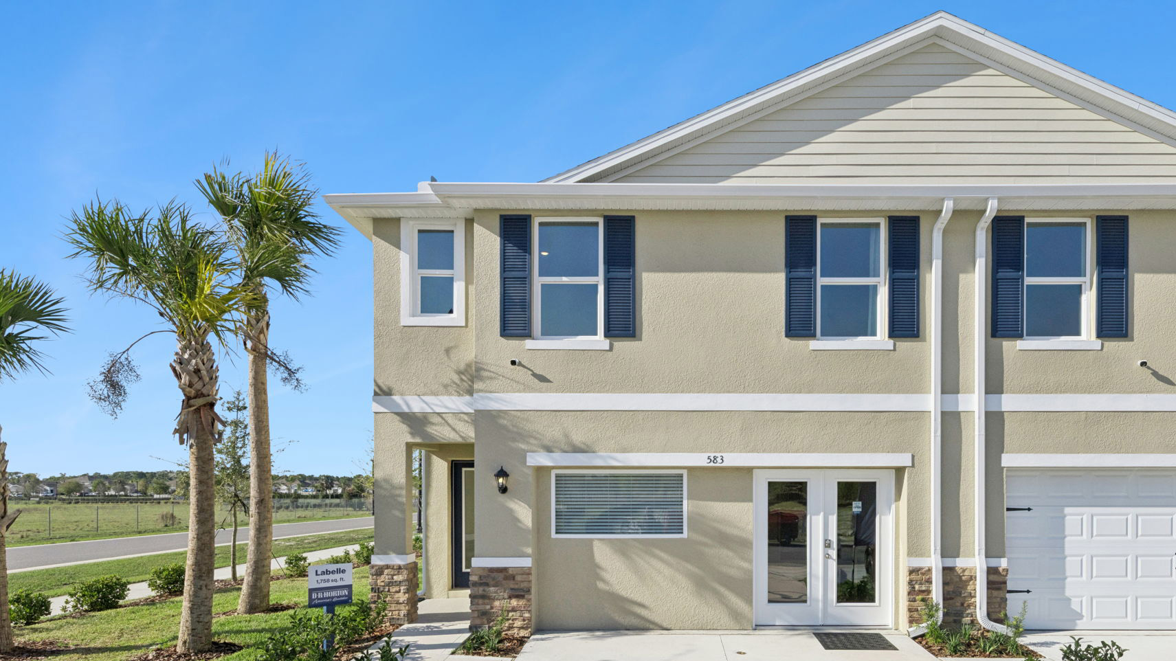 Attached townhome with concrete block construction and a one-car garage.