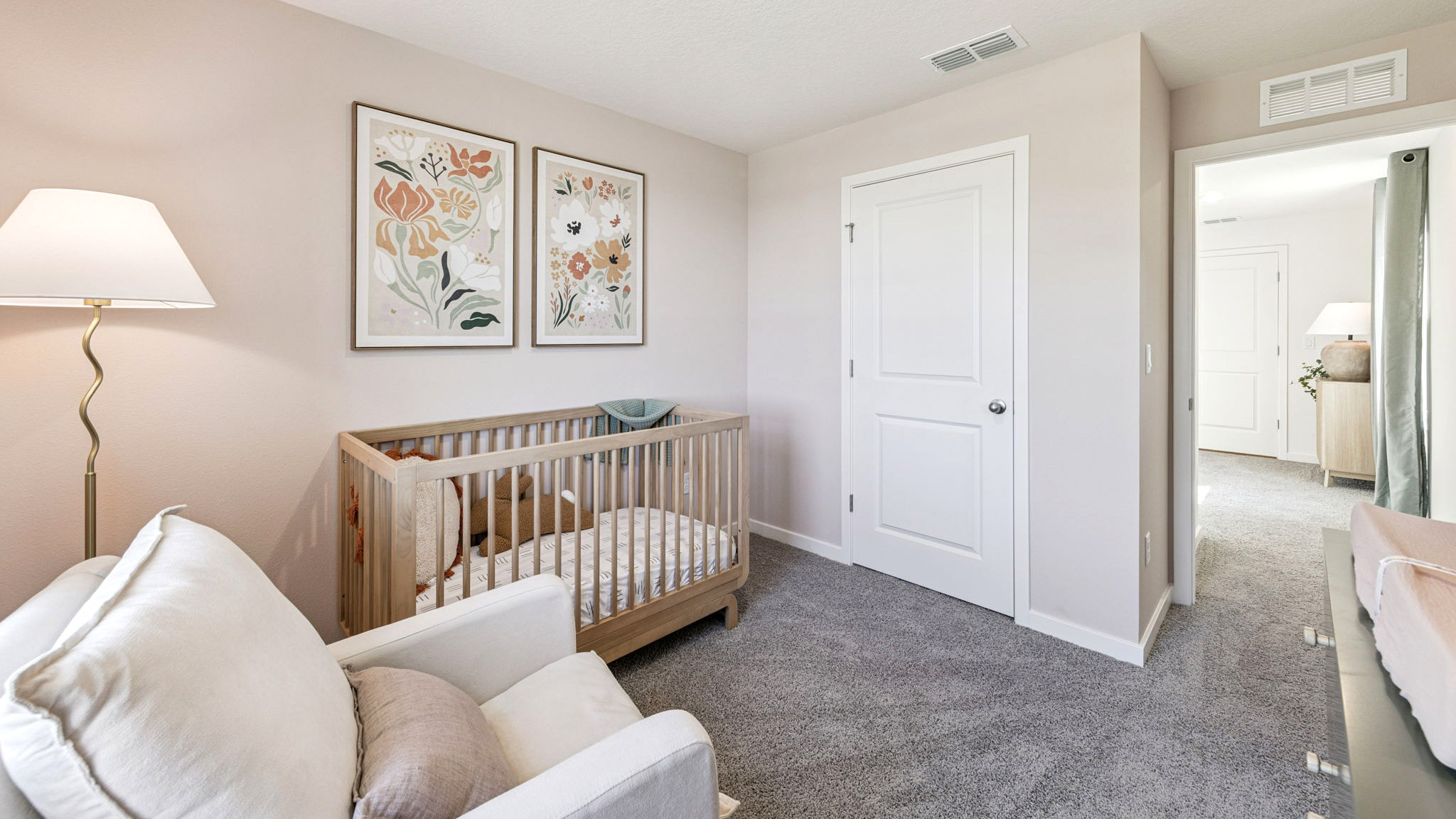 Guest bedroom with bed, nighstands and natural lighting.