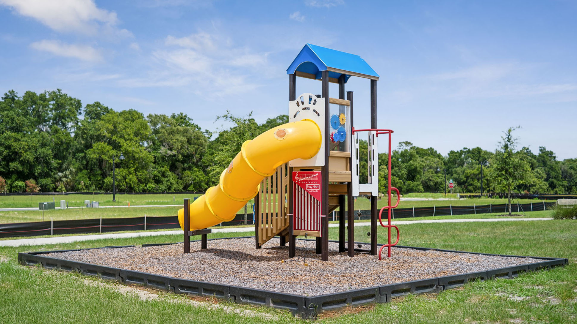 Playground surounded by grass