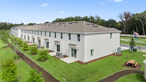 Backyard of the townhomes with picnic table