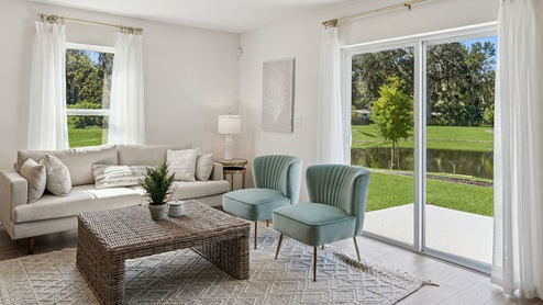 Livingroom with couch and seating and windows