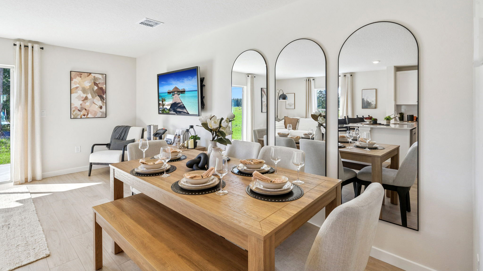 Living area with couch seating, entertainment system and natural lighting