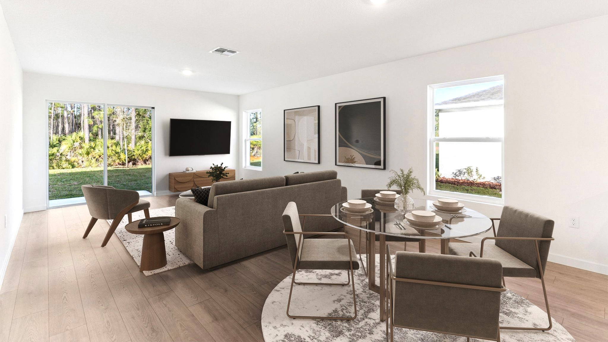 Living area with couch seating, entertainment system and natural lighting
