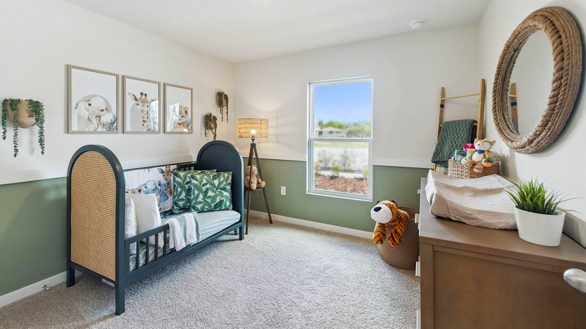 Single story new home with large windows and 2 car garage.