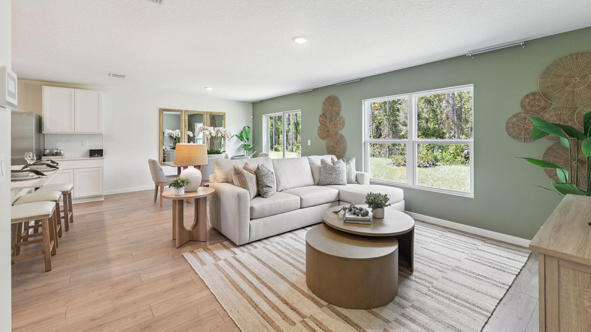 Living area with couch seating, entertainment system and natural lighting