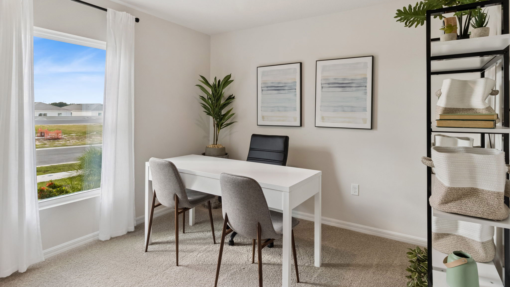 Functional home office with desk, chairs and space to work or play.